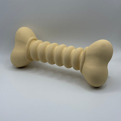 Ribbelbot hondenspeelgoed van natuurlijk rubber – paars of beige, ribbelstructuur beige schuin voorkant